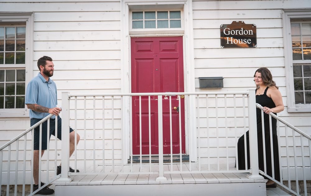 Couple photographed on the porch of the historic Gordon House in Amherstburg, Ontario
