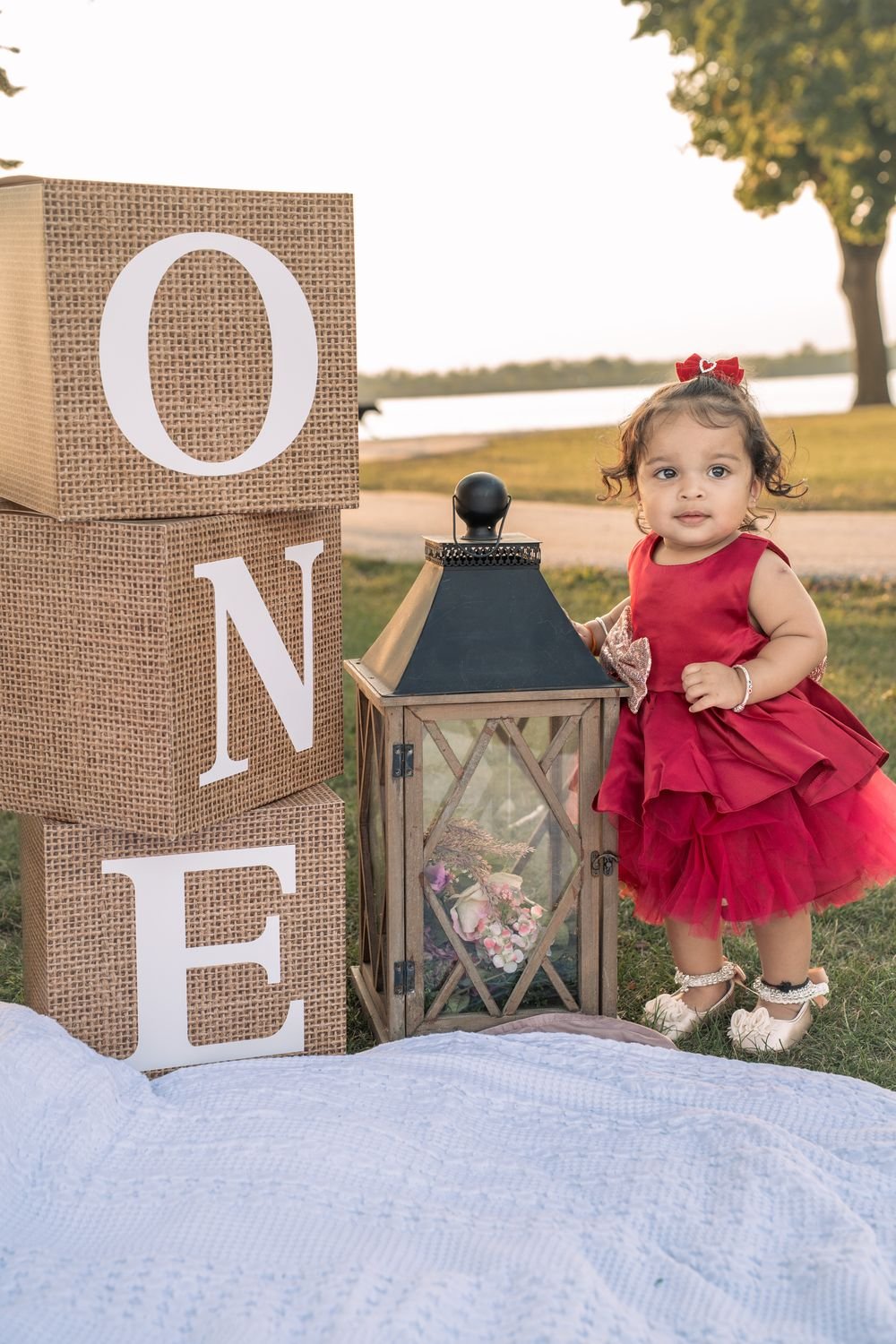 Parents lifting their daughter at a first birthday session in Windsor