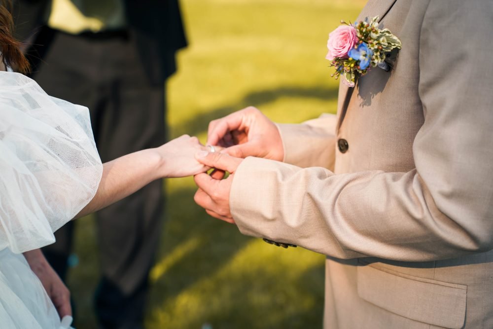 Groom is wearing a ring to bride on Wedding in LaSalle