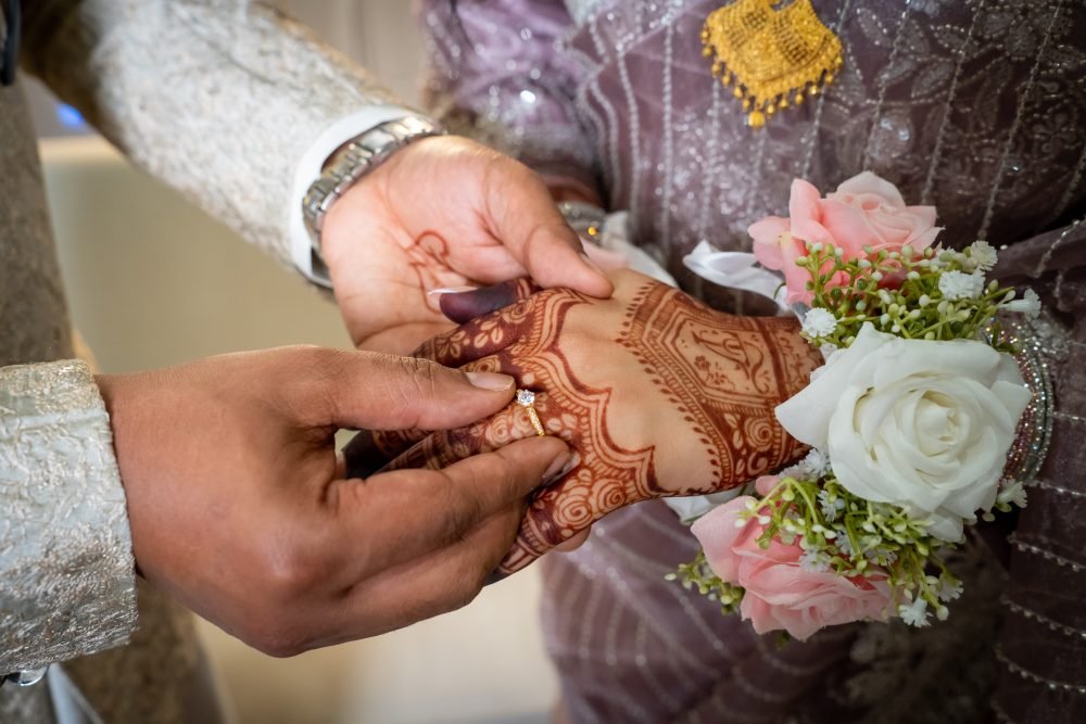 Groom wearing ring in Bridge hand at iDESI Chowrastha - Indian Restaurant in Windsor Ontario